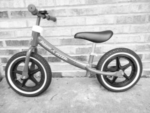 Black and white Radio Flyer Strider bike